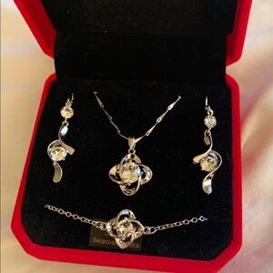 Brand new. Never worn. Love Joy Knot Set with Swarovski Crystals
